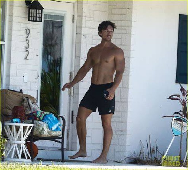 Bachelor Matt James Shirtless Sitting on a Car