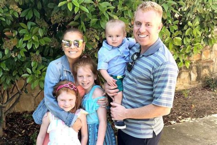 Bryan Redmond with his wife and kids