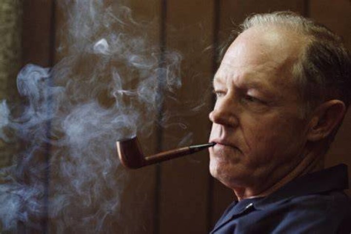 E Howard Hunt Smoking A Cigar
