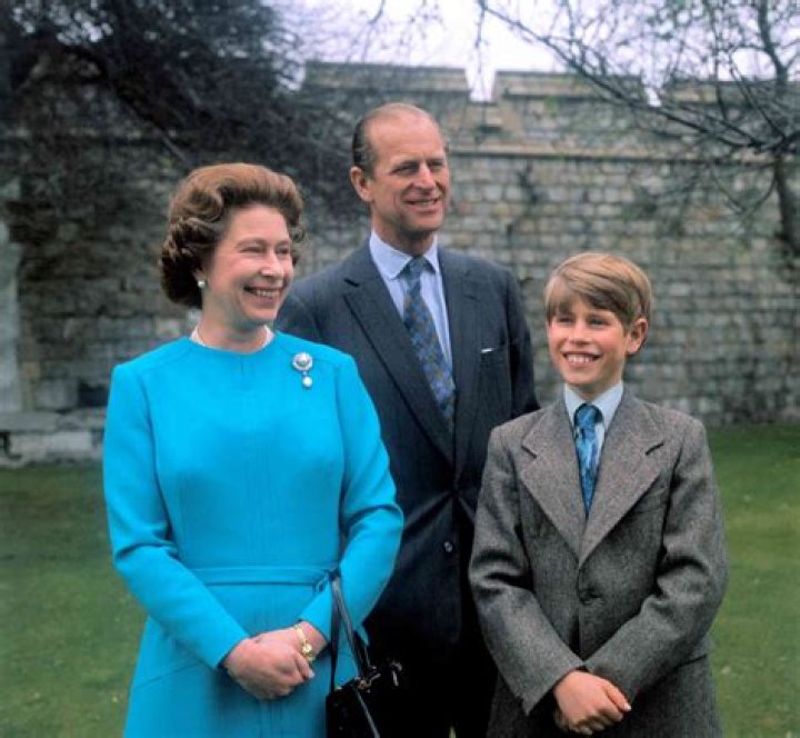 Queen Elizabeth posing with her great-grandchildren
