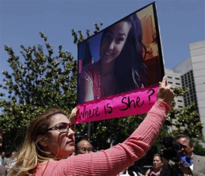 Woman Holding Sierra Lamar Photo